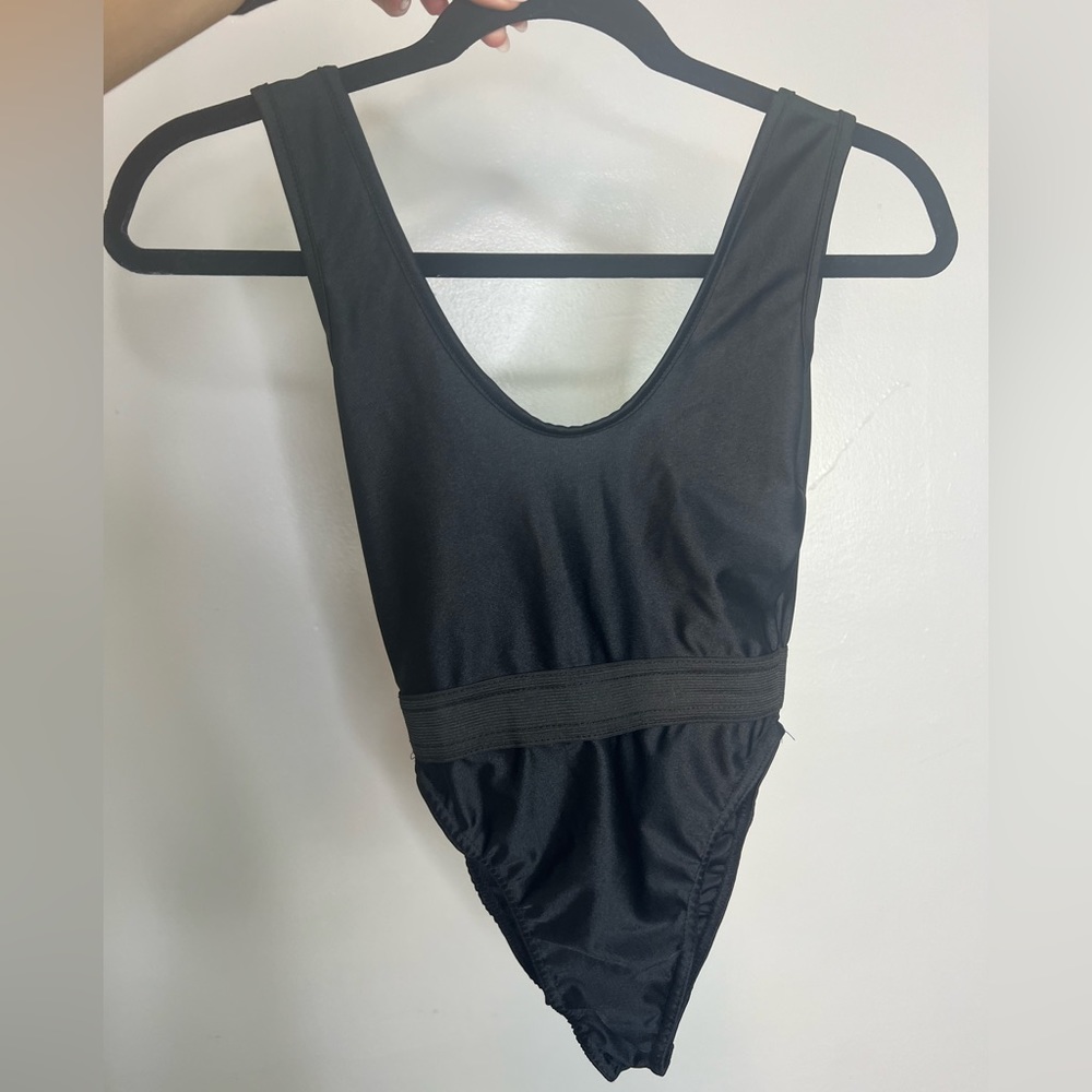 Pretty Little Thing, French cut black one piece swim suit with waist detail.